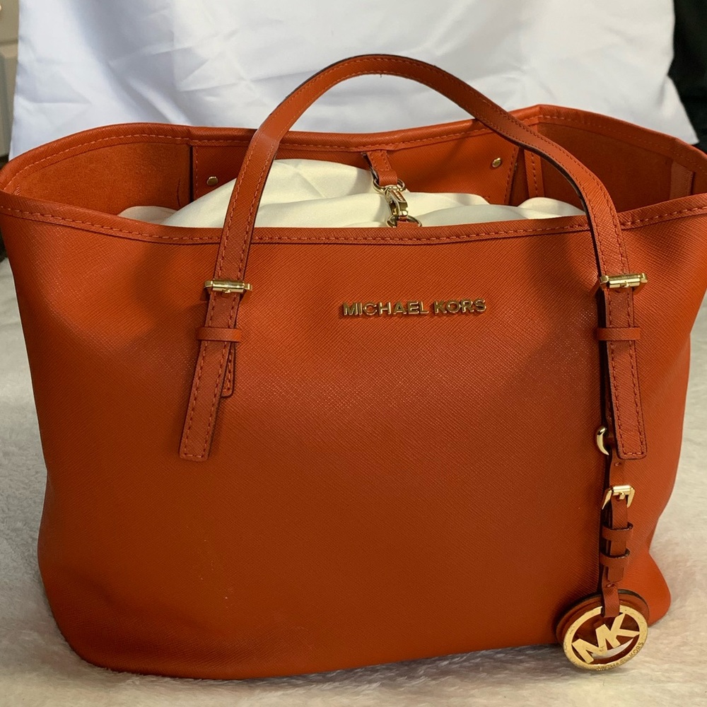 Burnt Orange Michael Kors purse.